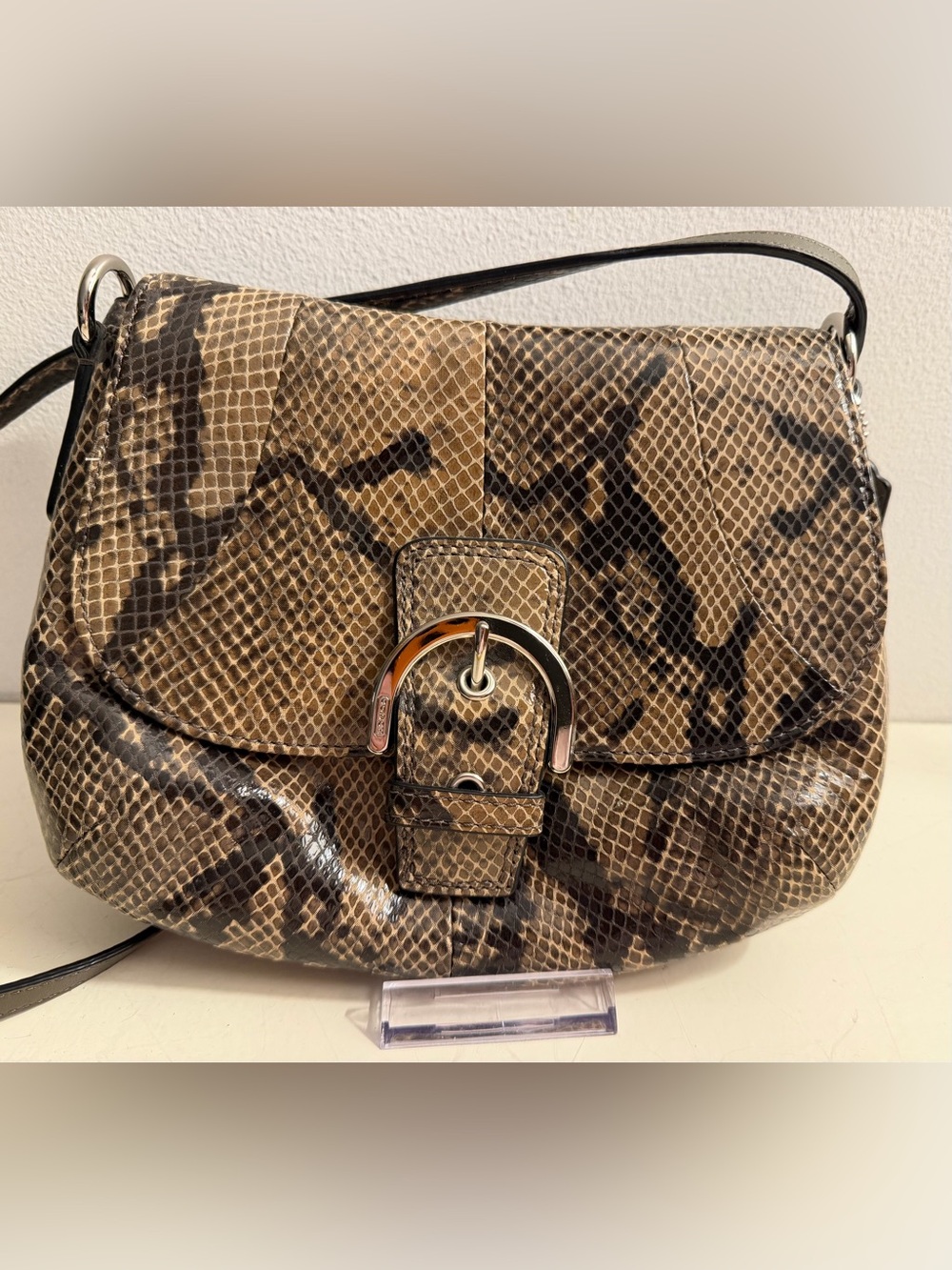 Coach vintage Soho snake pattern leather crossbody flap bag.